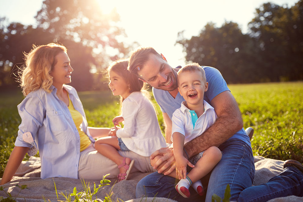 Young family of four at the park