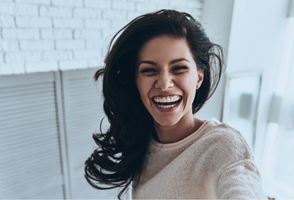 young woman showing off her bright smile