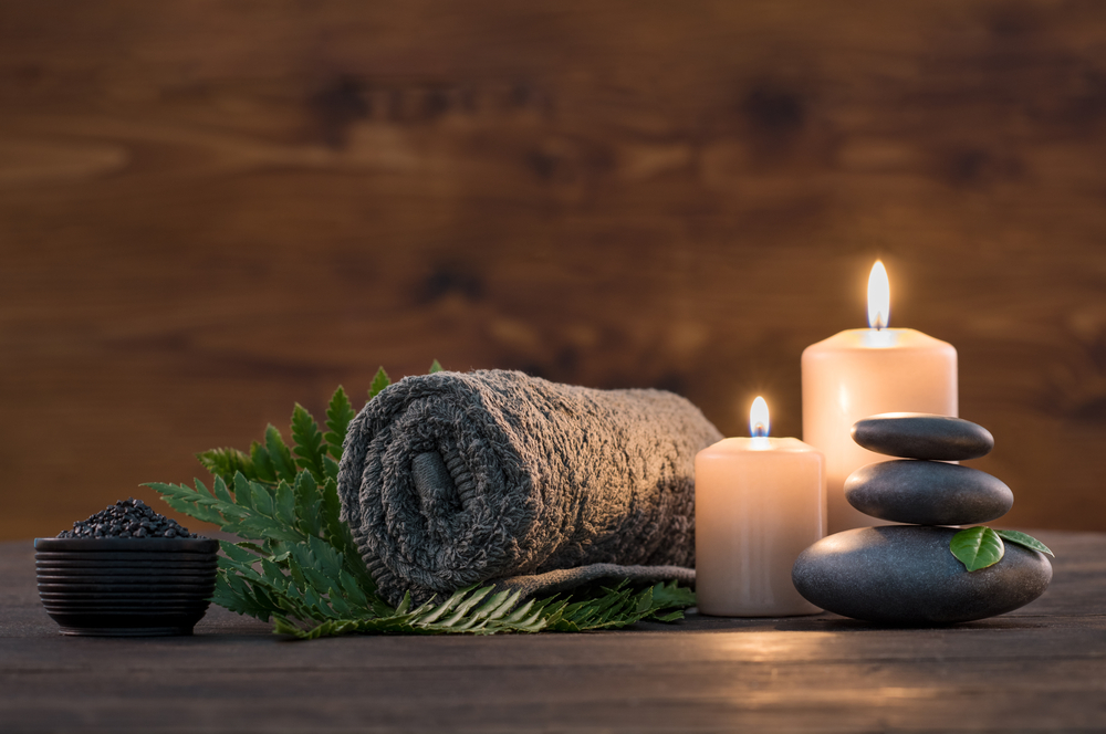 holistic treatments with candles, hot rocks, supplements, and more