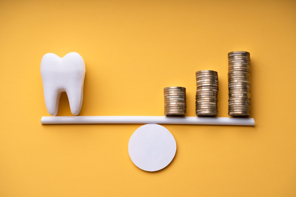tooth and coins as a balancing act