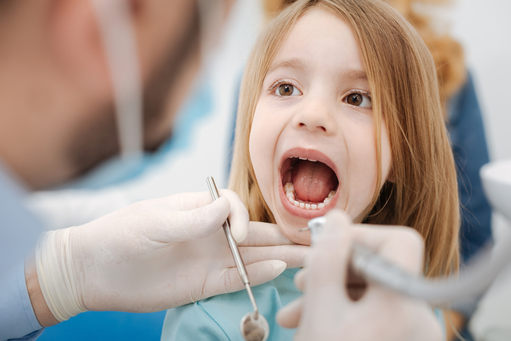 young girl at the dentist