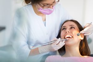 dentist and patient during a dental exam